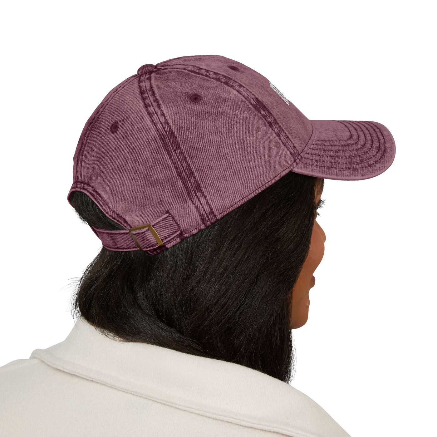 women wearing a maroon baseball cap on a white background