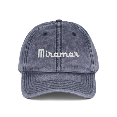 Denim cap with 'Miramar' logo on a white background