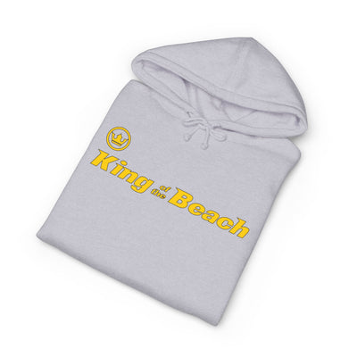 Folded gray hoodie with 'King of the Beach' text and logo on a white background