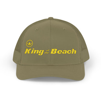 Green cap with 'King of the Beach' text on a white background