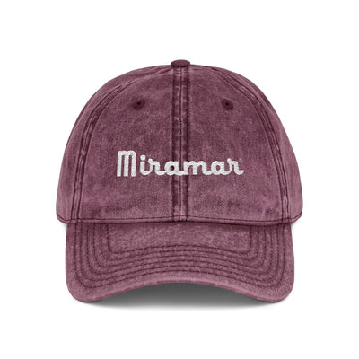 Maroon cap with 'Miramar' embroidered on a white background