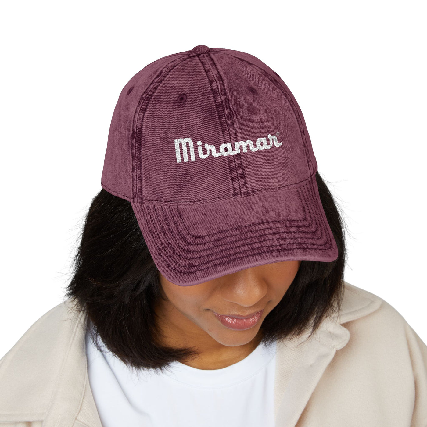 Women wearing a maroon cap with 'Miramar' text on a white background