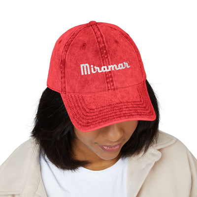 women in Red cap with 'Miramar' logo 
