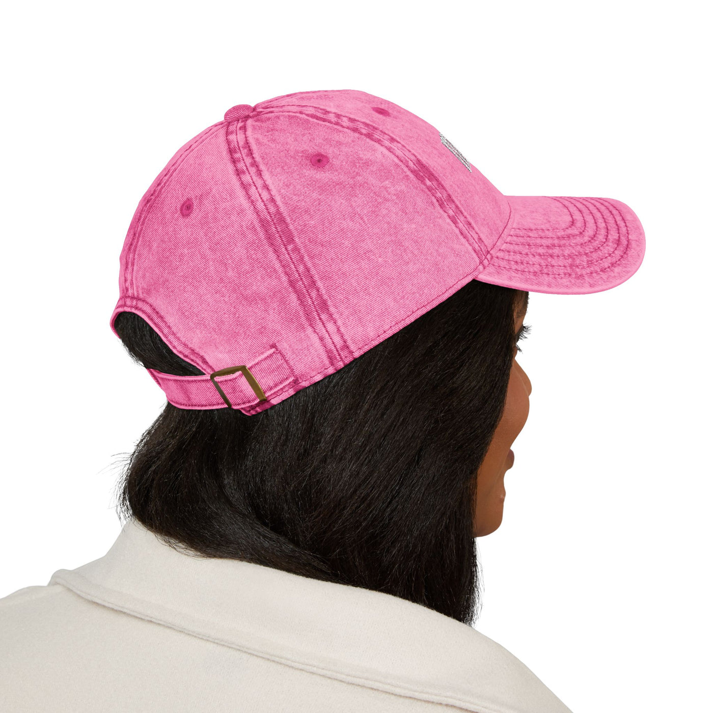 women  wearing a pink baseball cap on a white background