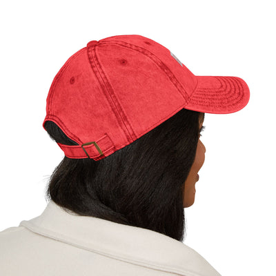 Person wearing a red cap on a white background