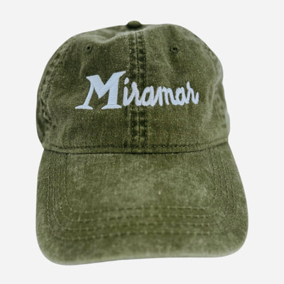 Green cap with 'Miramar' embroidered on a white background