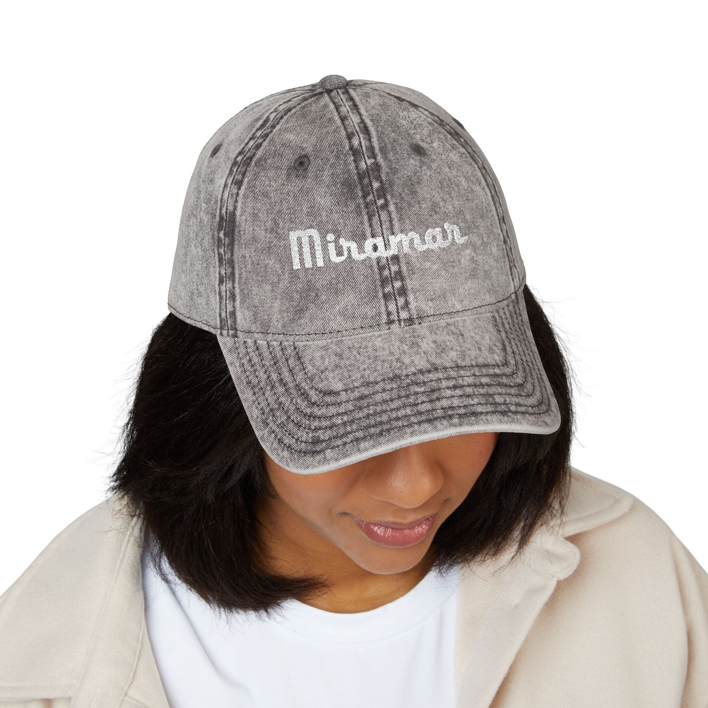 women  wearing a charcoal gray denim cap with 'Miramar' branding on a white background