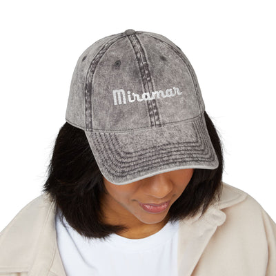 women  wearing a charcoal gray denim cap with 'Miramar' branding on a white background