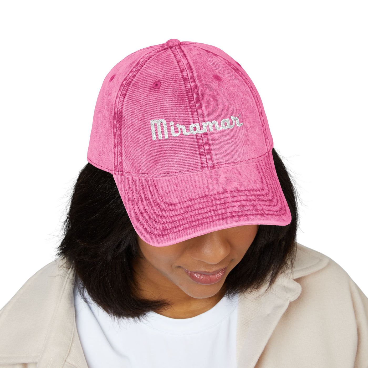 women wearing a pink cap with 'Miramar' logo on a white background